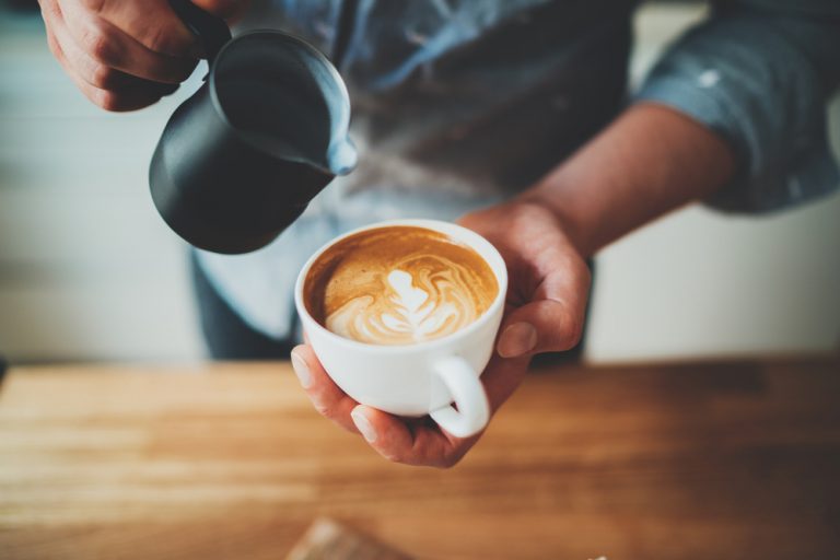 Closeup,Image,Of,Male,Barista,Holding,And,Pouring,Milk,For