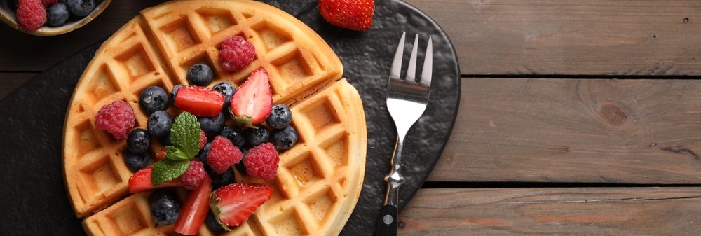 Tasty,Belgian,Waffle,With,Fresh,Berries,Served,On,Wooden,Table,